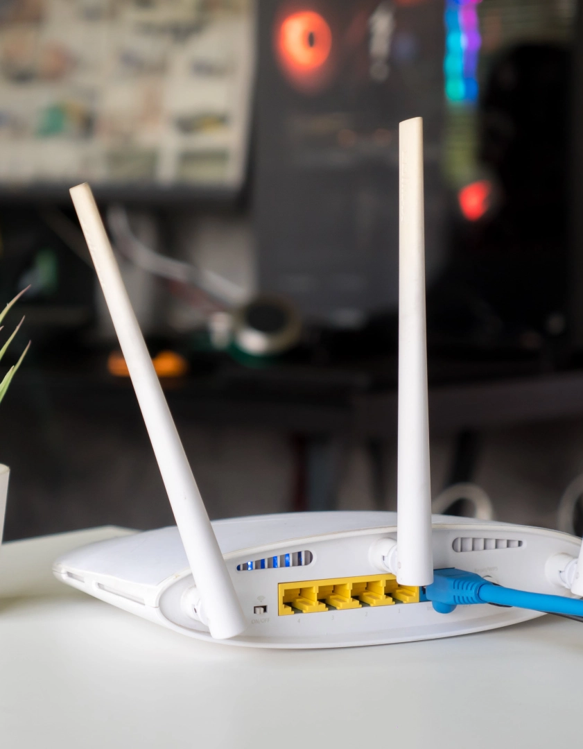White wireless router with two antennas.